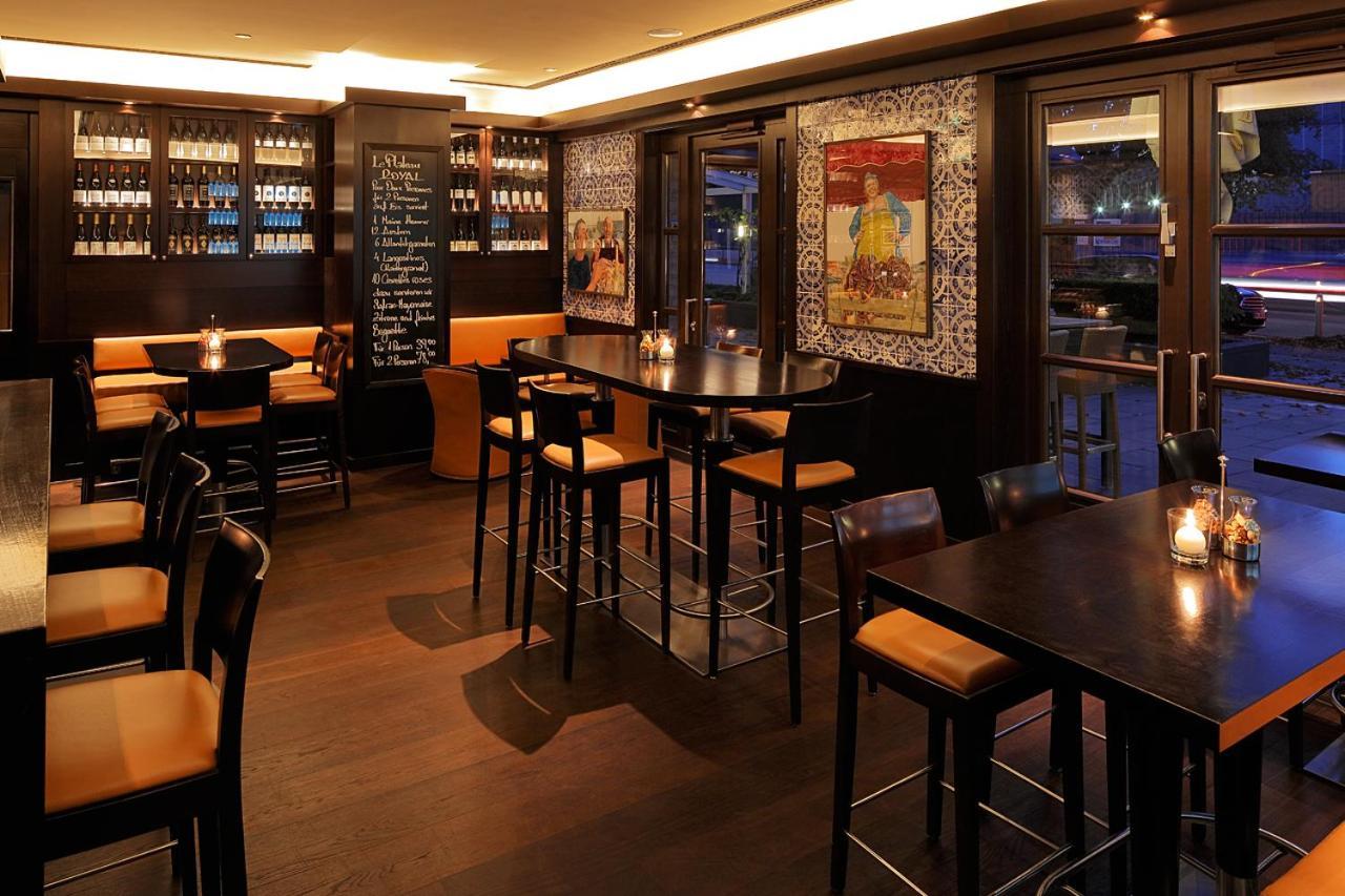 GRAND ELYSEE Hamburg Bagian luar foto The interior of the restaurant